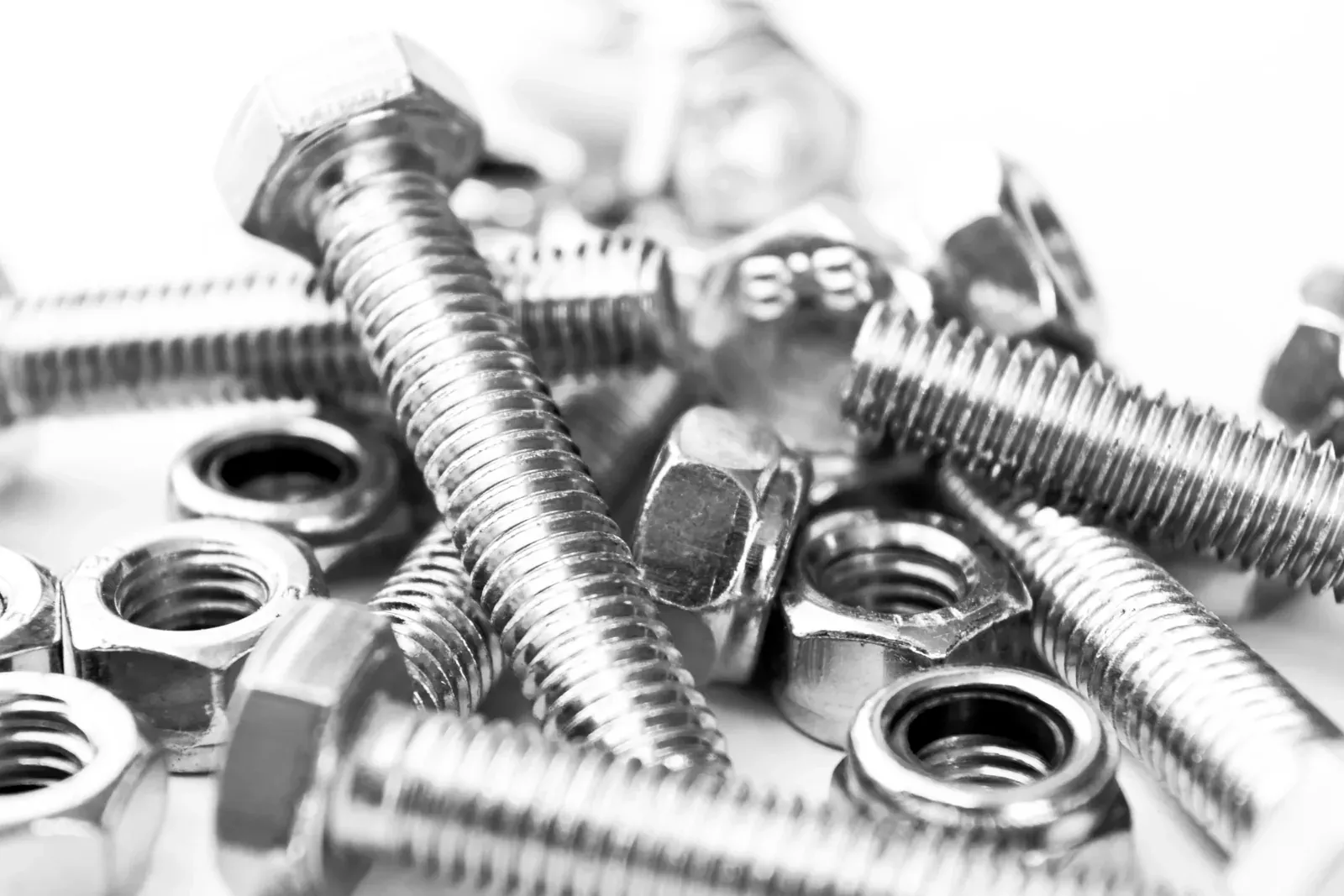 A pile of cold-headed hex bolts and nuts