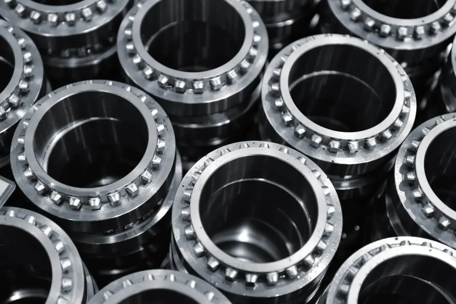 Turned and drilled steel rings stacked after machining
