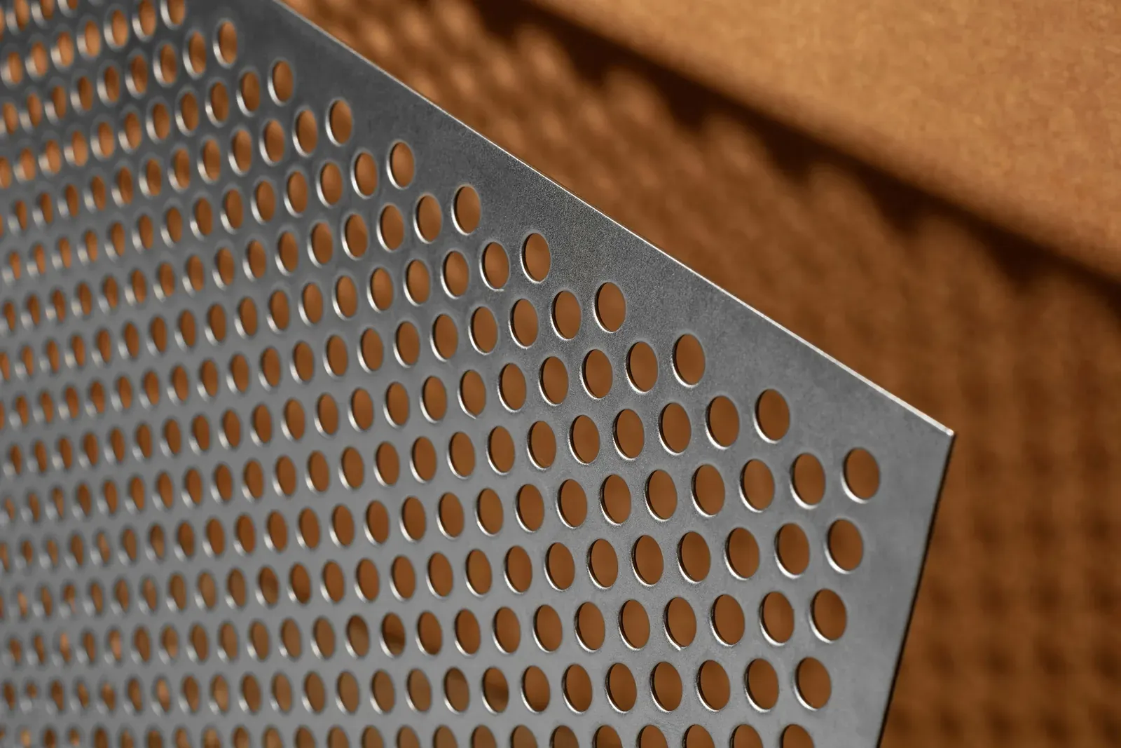 Perforated sheet-metal stamping with round holes